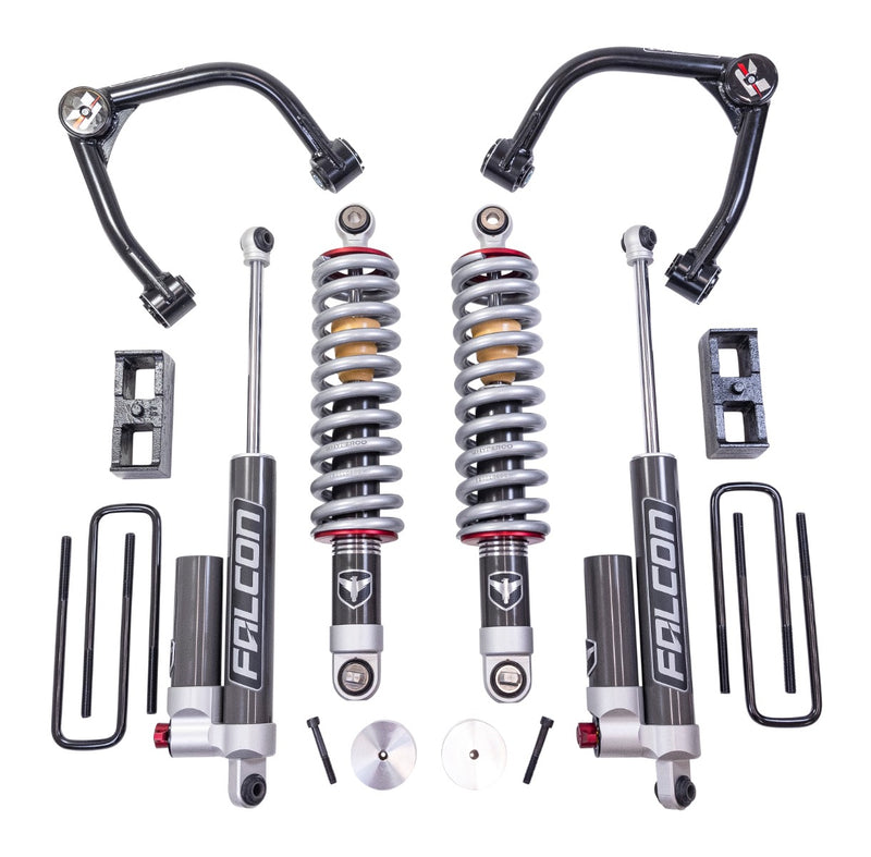 ReadyLIFT Suspension System, full kit on a studio background: two black upper control arms, two Falcon coilovers, two Falcon rear shocks, rear blocks and U-bolts on white