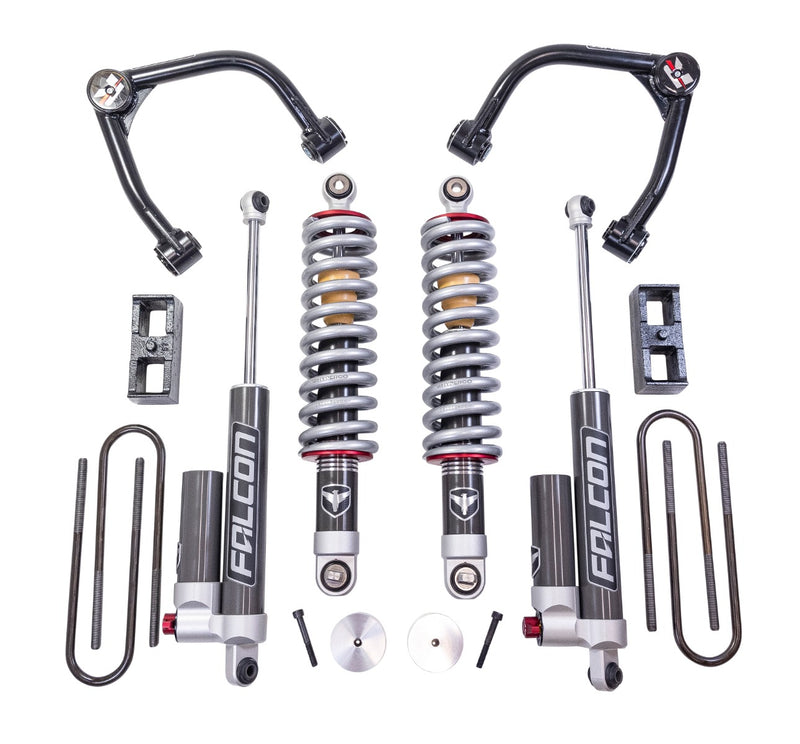ReadyLIFT Suspension System, full kit on a studio background: two black upper control arms, two Falcon coilovers, two Falcon rear shocks, rear blocks and U-bolts on white