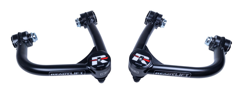 ReadyLIFT Tubular Upper Control Arms, full kit on a studio background: two black ReadyLIFT tubular upper control arms with red R caps facing each other on white