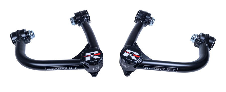 ReadyLIFT Tubular Upper Control Arms, full kit on a studio background: two black ReadyLIFT tubular upper control arms with red R caps facing each other on white