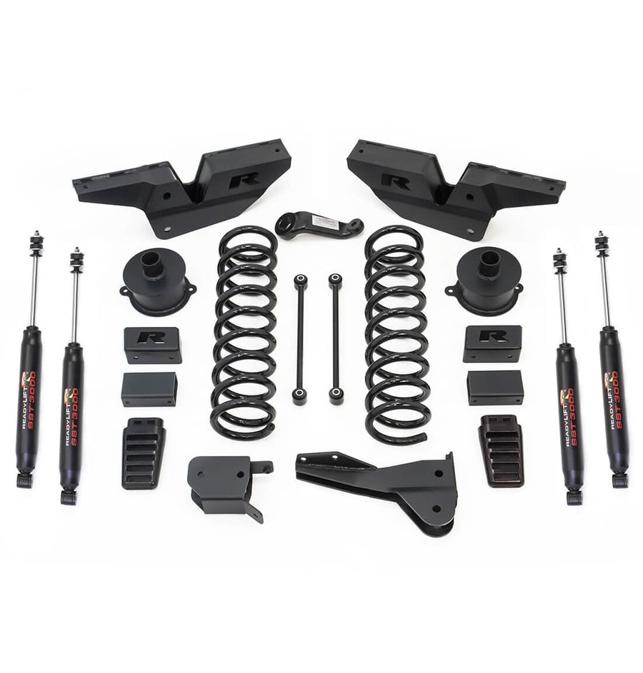 Big Lift Kits by ReadyLIFT: ReadyLIFT Ram 2500 kit with radius arm brackets, coil springs, spacers, blocks, links and four SST3000 shocks on white.