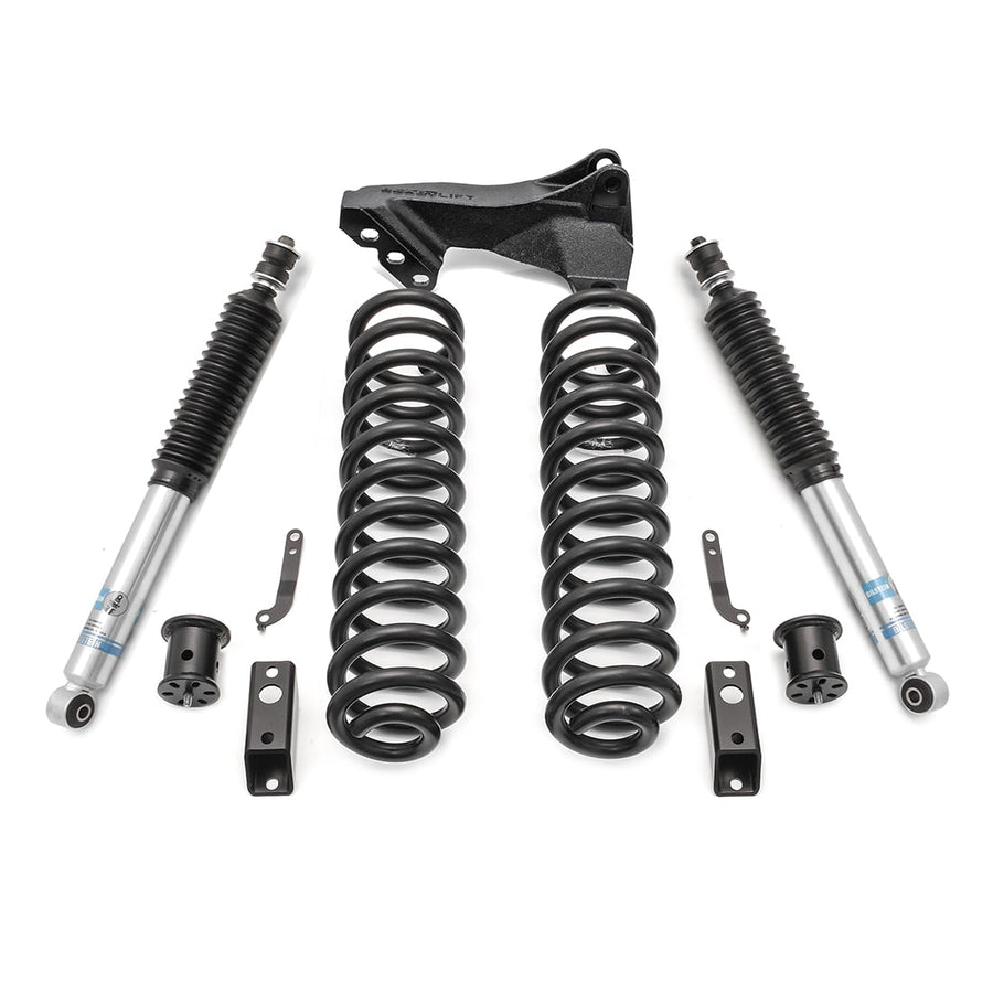Leveling Kits by ReadyLIFT: Coil springs with track bar bracket, two Bilstein shocks and hardware on white.