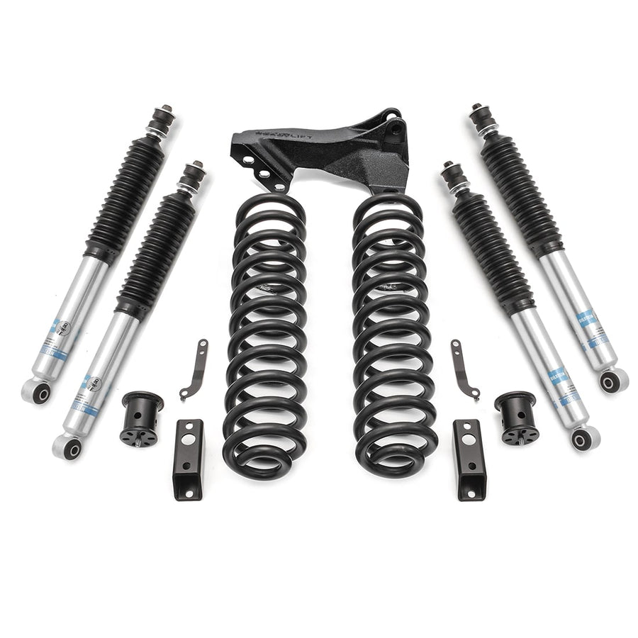 Leveling Kits by ReadyLIFT: Coil springs with track bar bracket, four Bilstein shocks and hardware on white.
