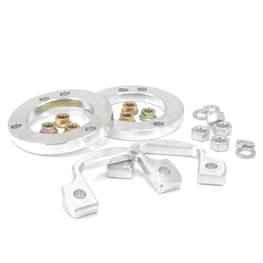 Leveling Kits by ReadyLIFT: Two aluminum spacer rings with brackets, nuts and washers on white.