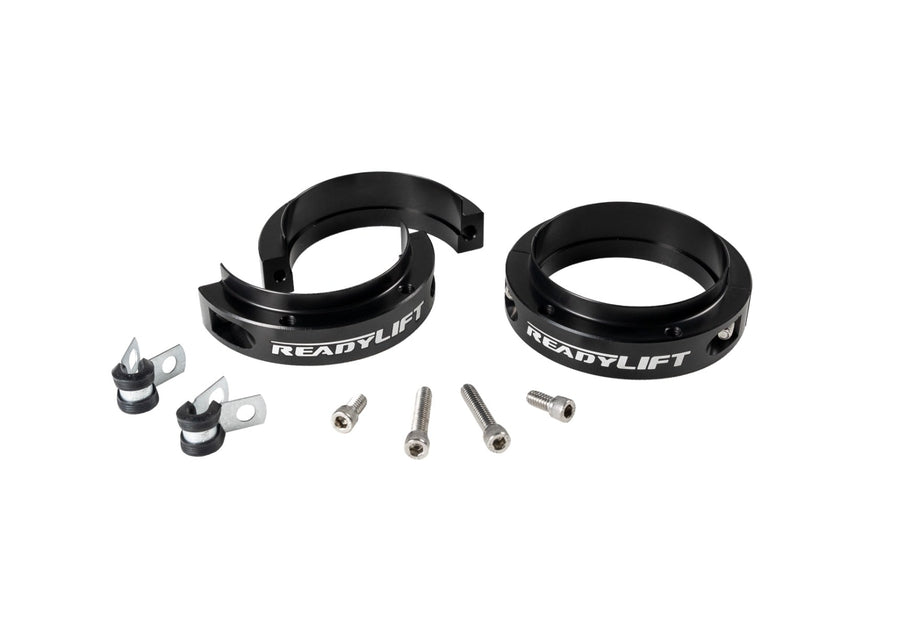 Leveling Kits by ReadyLIFT: Two black split ReadyLIFT spacer rings with clamps and bolts on white.