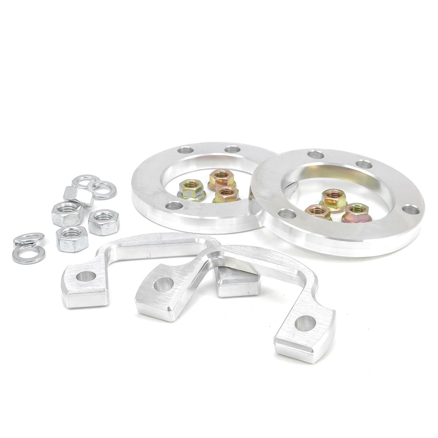 Leveling Kits by ReadyLIFT: Two aluminum spacer rings with nuts, washers and two aluminum brackets on white.