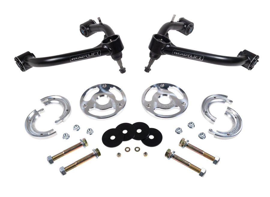 Leveling Kits by ReadyLIFT: Two ReadyLIFT upper control arms with aluminum spacers, rings, washers and bolts on white.