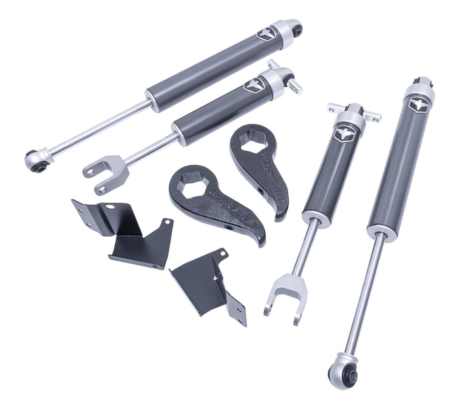 Performance Leveling Kits by ReadyLIFT: Four grey Falcon 2.1 shocks, two forged torsion keys and two brackets arranged at an angle on white.