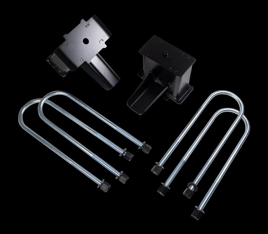 Rear Block Kits by ReadyLIFT: Two tall black fabricated rear lift blocks with four zinc round U-bolts and nuts on a black background.