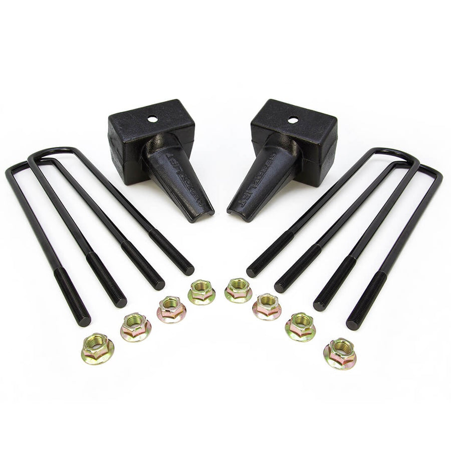 Rear Block Kits by ReadyLIFT: Two tapered black rear blocks with four U-bolts and flange nuts on white.
