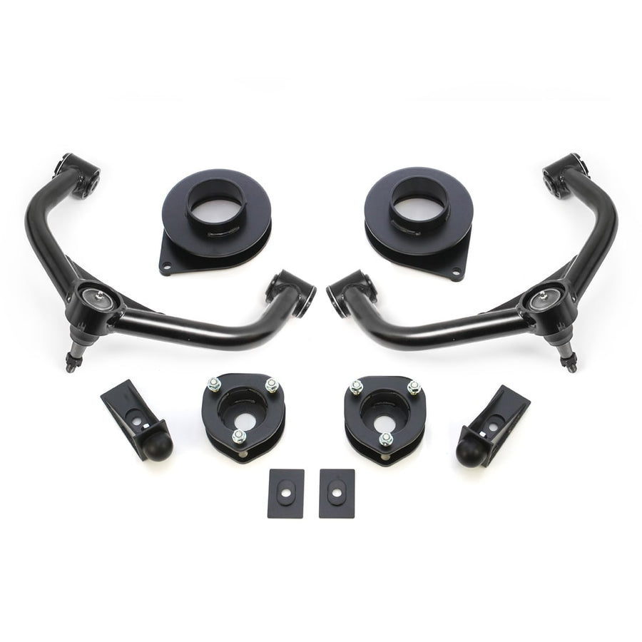 SST Lift Kits by ReadyLIFT: Two black upper control arms, strut spacers, rear coil spacers, bump stop extensions and plates on white.