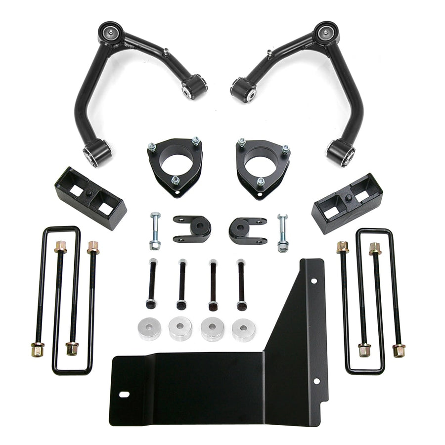 SST Lift Kits by ReadyLIFT: Two black upper control arms, strut spacers, rear blocks, U-bolts, spacers and a black skid plate on white.