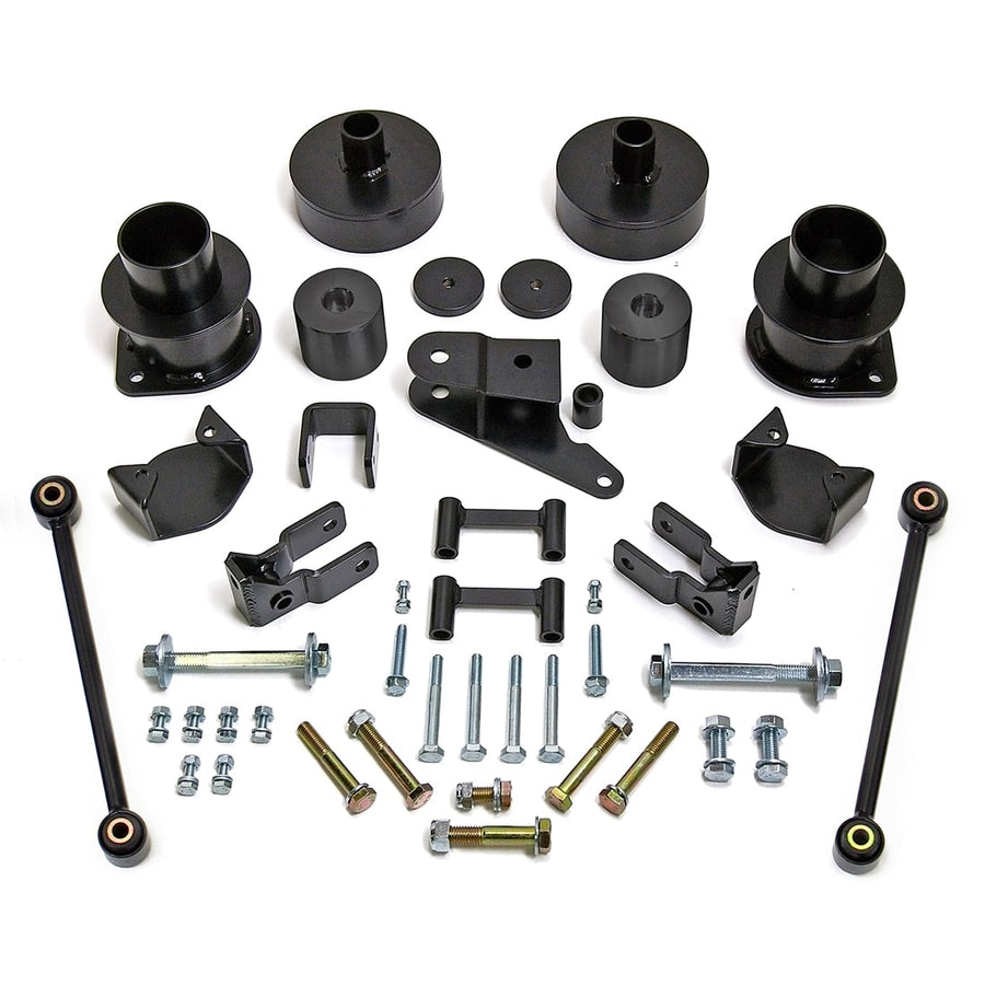 SST Lift Kits by ReadyLIFT: Black coil spacers, bump stop spacers, brackets, sway bar links and bolts on white.