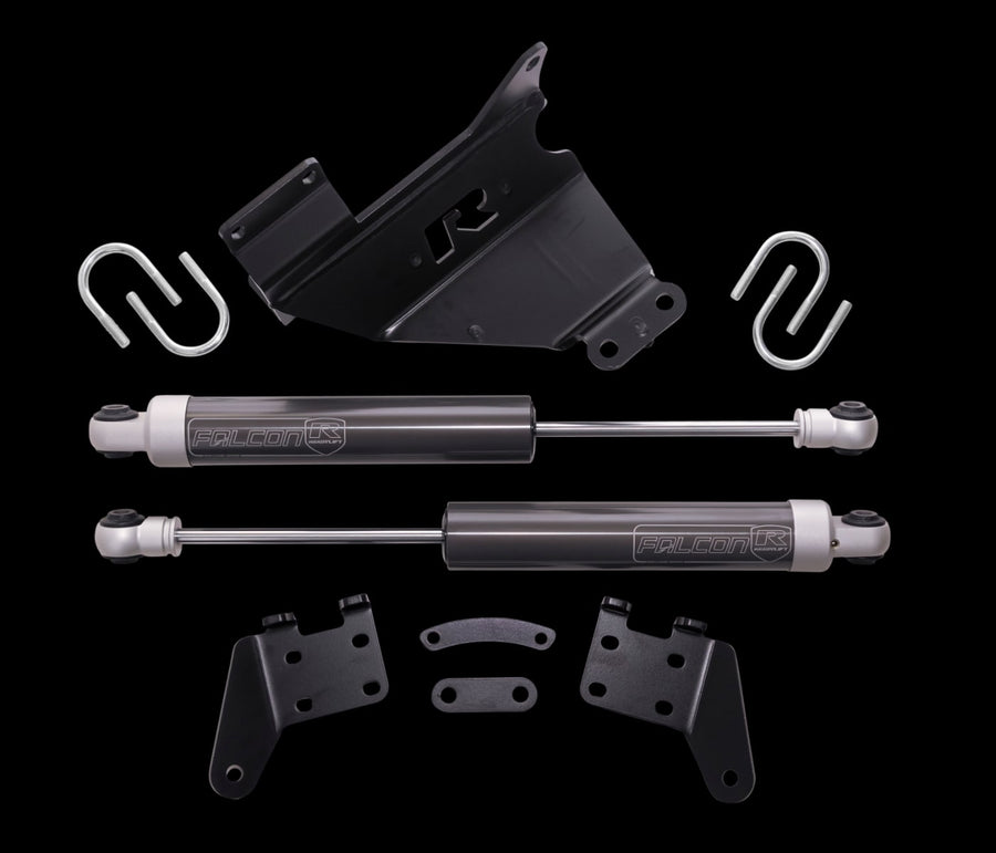 Steering Stabilizers by ReadyLIFT: A black ReadyLIFT R bracket, two Falcon steering stabilizers, U-bolts and mounting brackets on a black background.