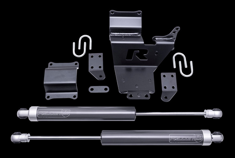Steering Stabilizers by ReadyLIFT: A black ReadyLIFT R bracket, two Falcon steering stabilizers, U-bolts and brackets on a black background.