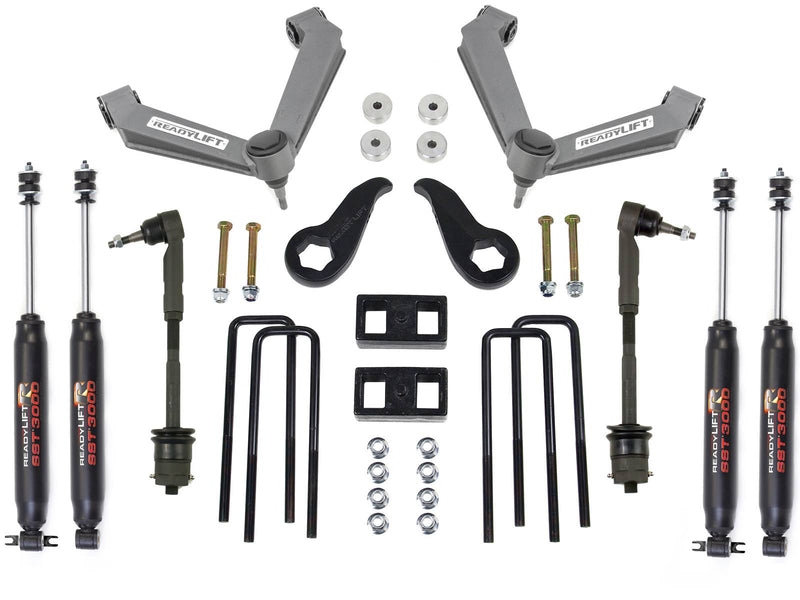 Two gray fabricated upper control arms, torsion keys, tie rods, blocks, U-bolts and four black ReadyLIFT shocks on white