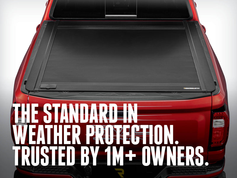 Top-down rear view of the closed ONE MX on a red pickup, THE STANDARD IN WEATHER PROTECTION. TRUSTED BY 1M+ OWNERS. caption
