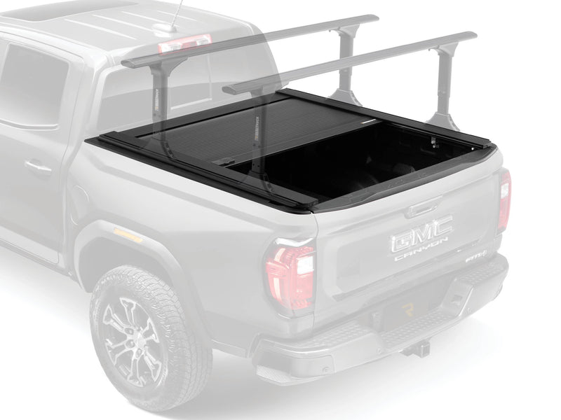 Illustration of the RetraxONE XR part-open in full color with the pickup and crossbar rack ghosted in light gray (crossbars sold separately)