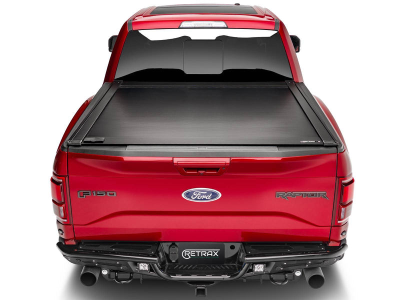 Straight rear view of a red pickup with the PowertraxONE XR closed
