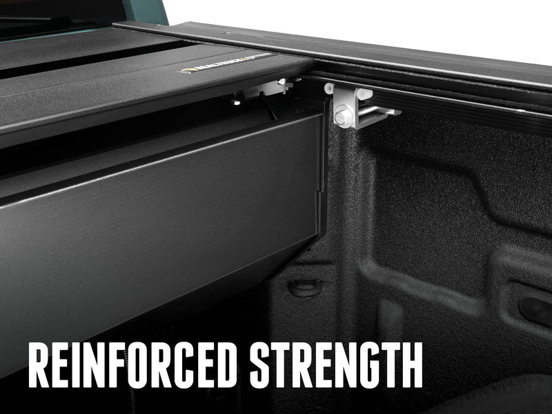 Canister and silver rail clamp inside the bed at the cab end, REINFORCED STRENGTH caption