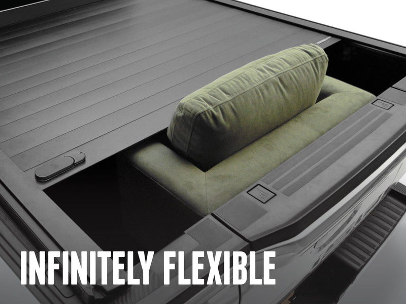 Cover retracted part-way with a cushion standing up through the opening, overlay Infinitely Flexible