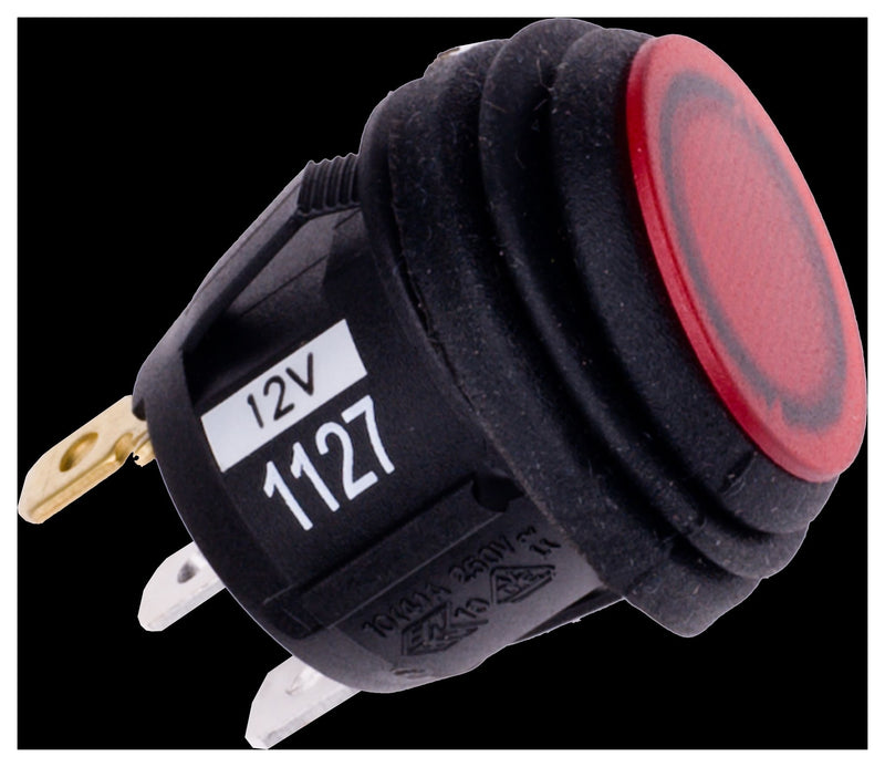 Rigid 2-Position Rocker Switch, Red on a studio background: A round black rocker switch with a red lit-style rocker and spade terminals is shown on black