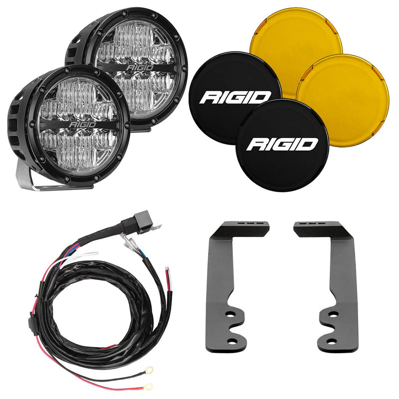Rigid 360-Series 6" Drive A-Pillar Light Kit, kit contents laid out: kit layout of two black round 360-Series LED lights with black and amber covers, a wiring harness and two A-pillar brackets on white