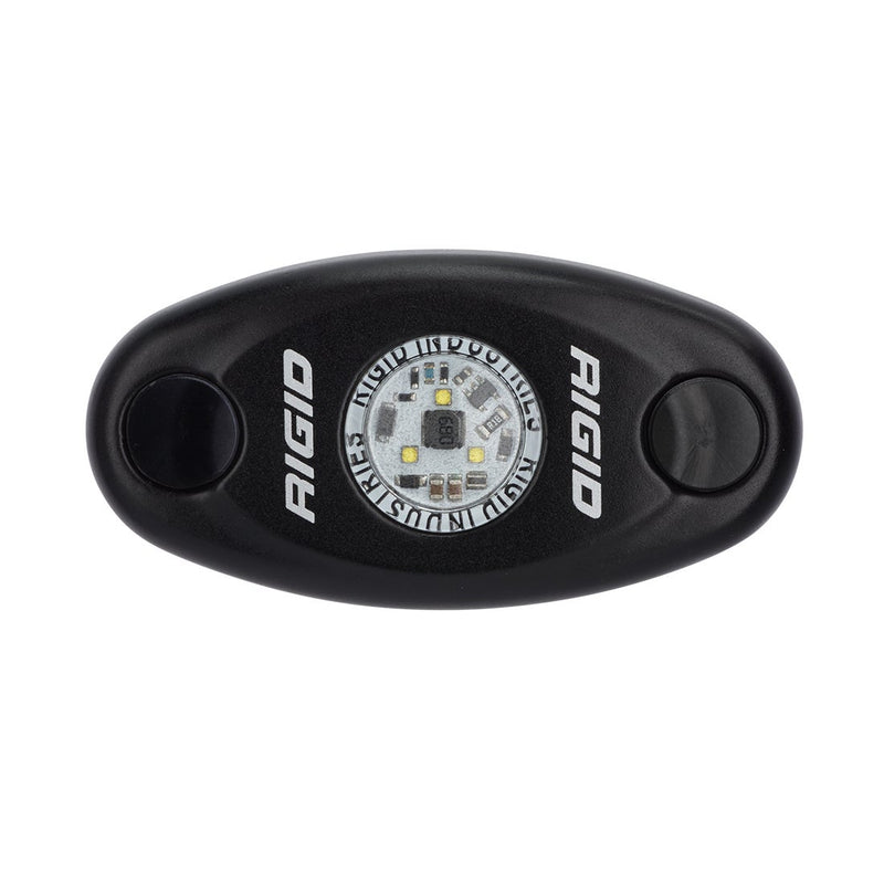 Rigid A-Series Low Power on a studio background: black oval rock light with a single LED and Rigid lettering, top view on white