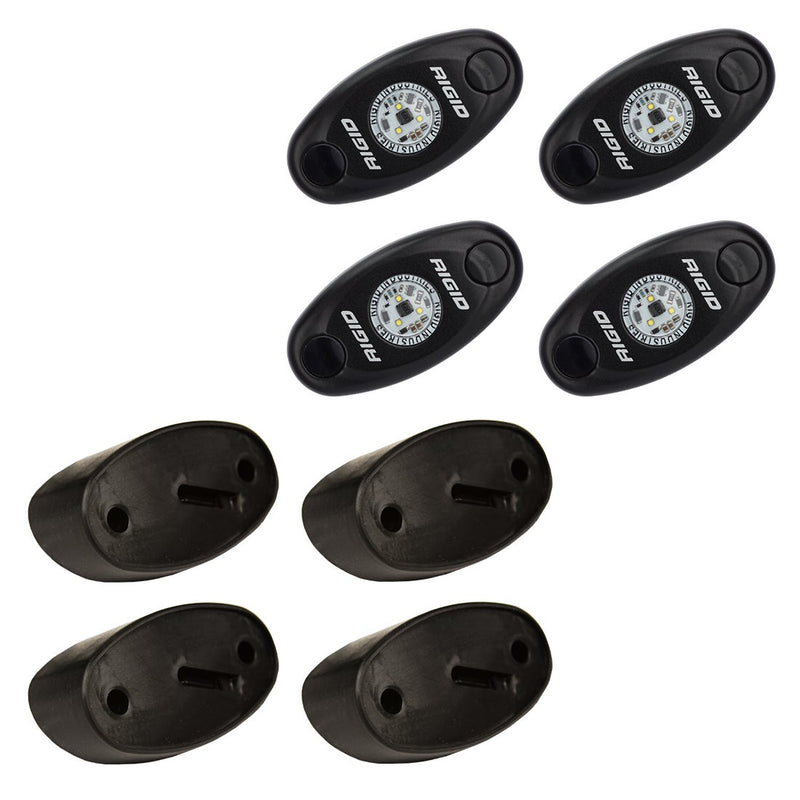 Rigid A-Series Rock Light Kit 4, kit contents laid out: four black oval rock lights above four black angled mounting bases on white