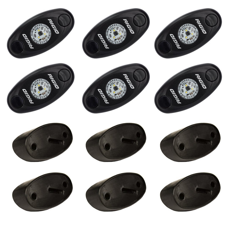 Rigid A-Series Rock Light Kit 6, kit contents laid out: six black oval rock lights above six black angled mounting bases on white