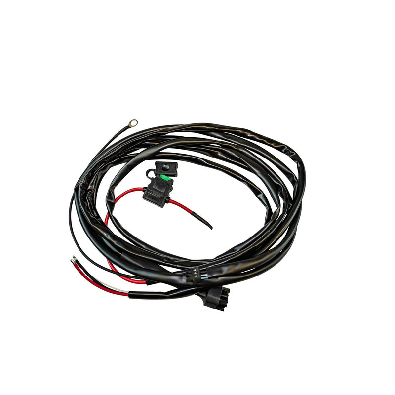 Rigid Adapt Light Bar Small Wire Harness on a studio background: coiled black wire harness with inline fuse holder, red lead and ring terminal on a white background