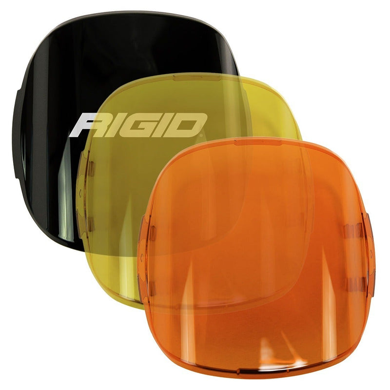 Rigid Adapt XE Cover, kit contents laid out: black, yellow and amber lens covers overlapped, with the Rigid logo on the black cover