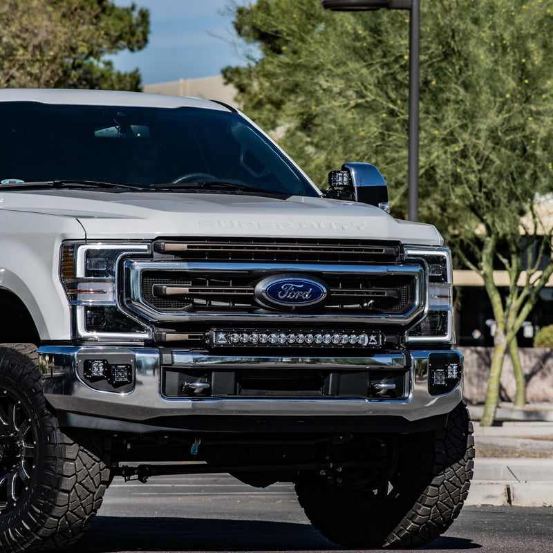 Rigid Bumper Bar Mount installed on a Ford F-250/F-350 Super Duty: front three-quarter view of a white Ford Super Duty with a light bar mounted in the bumper