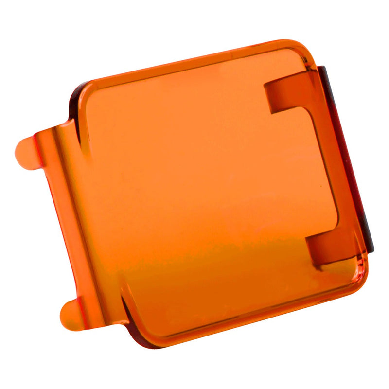 Rigid D-Series Cover on a studio background: an amber translucent D-Series snap-on lens cover on a white background