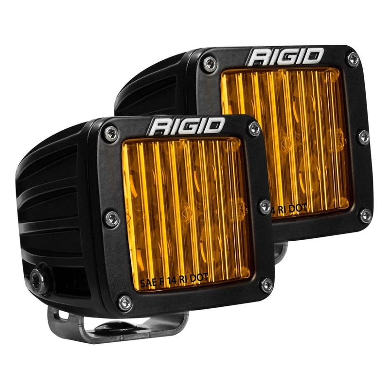 Rigid D-Series PRO SAE Pods Pair on a studio background: A pair of black square SAE pods with yellow fluted fog lenses and stainless mounting feet on a white background