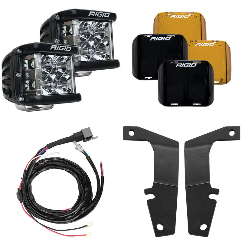 Rigid D-SS Flood A-Pillar Light Kit, kit contents laid out: two Rigid D-SS pods, amber and black covers, a wiring harness and two black A-pillar brackets are laid out on white