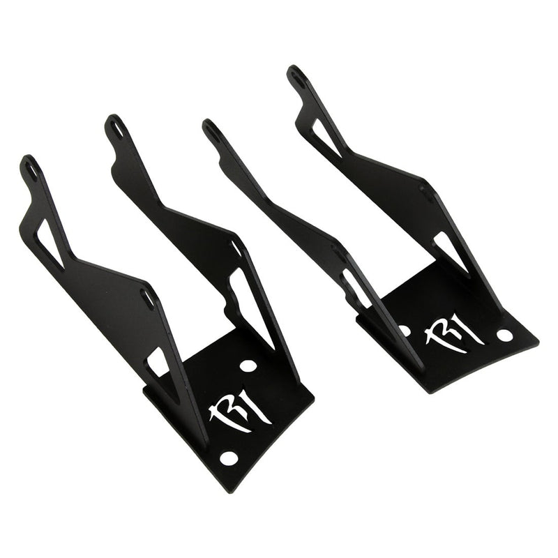 Rigid Dual D-Series A-Pillar Mount Kit, kit contents laid out: two tall black dual-pod A-pillar brackets with a cut-out Rigid logo sit on white