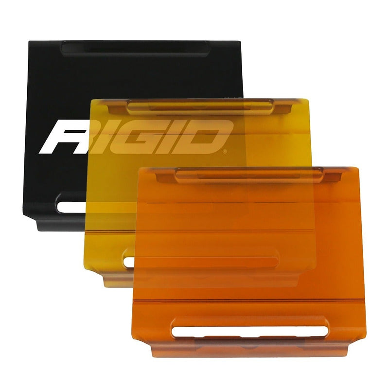 Rigid E-Series 4" Cover on a studio background: black, yellow and amber E-Series 4" light covers fanned out on a white background