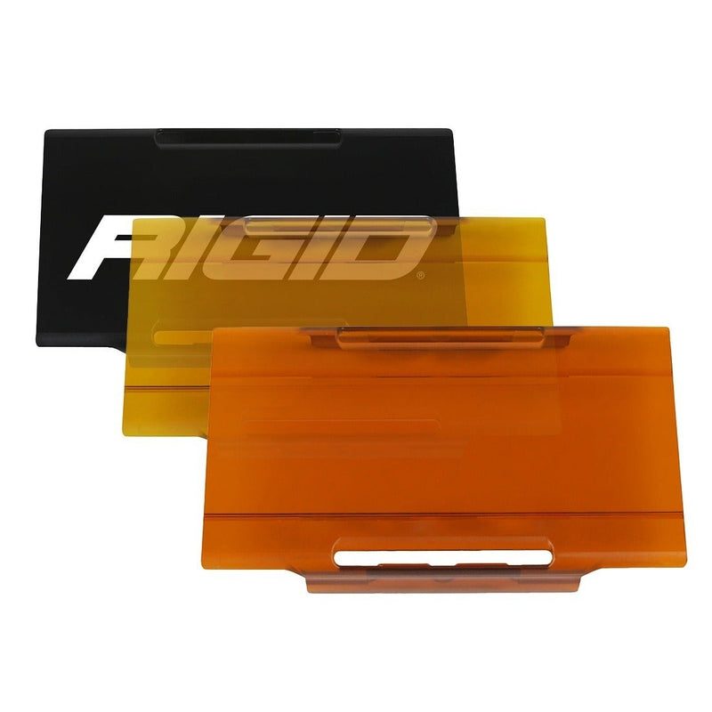 Rigid E-Series 6" Cover on a studio background: black, yellow and amber E-Series 6" light covers fanned out on a white background