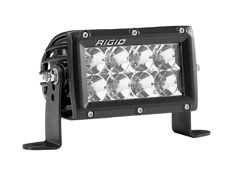 Rigid E-Series PRO 4" on a studio background: black 4" E-Series PRO LED light with eight flood reflectors on side brackets, angled view against white
