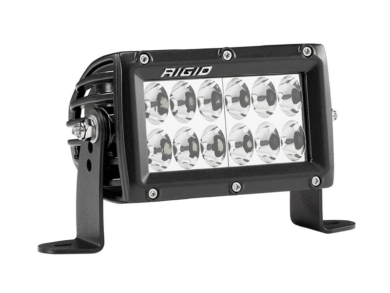 Rigid E-Series PRO 4" on a studio background: black 4" E-Series PRO LED light with twelve driving reflectors on side brackets, angled view against white