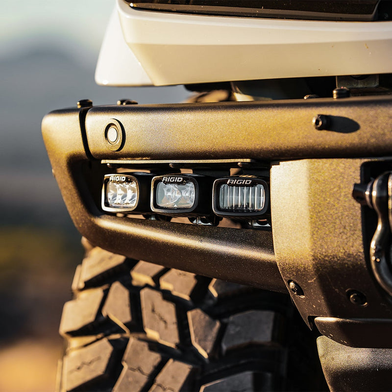 Rigid Mod Bumper Fog Mounts installed on a Ford Bronco: three Rigid SR-M pods mounted on the modular front bumper of a Ford Bronco