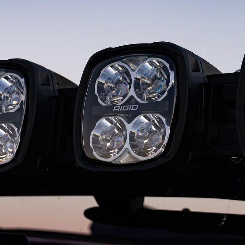 Close-up of the Rigid Phoenix 30" Connect Bar: close-up of a square quad-optic Rigid pod on a roof-mounted connect bar at dusk