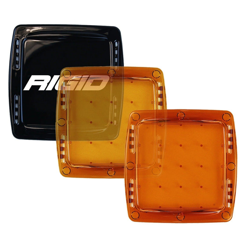 Rigid Q-Series Pod Cover on a studio background: three square Q-Series light covers in black, yellow and amber are fanned out on white