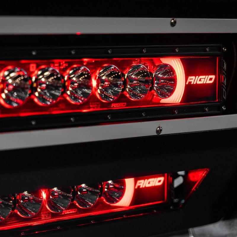 Rigid Radiance+ 40" RGBW installed on a vehicle: two Radiance+ LED light bars set into a black bumper with their backlights glowing red at night