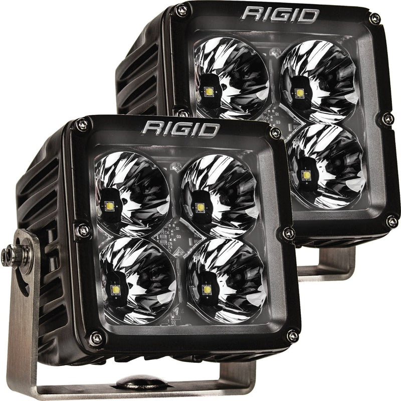 Rigid Radiance+ Pod XL RGBW Pair on a studio background: pair of black Radiance+ XL pods angled one behind the other with four reflector optics each and stainless brackets
