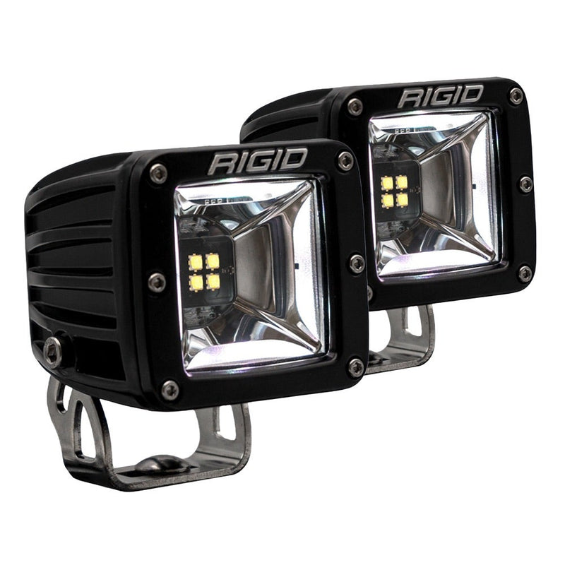 Rigid Radiance+ Scene RGBW Pods Pair on a studio background: pair of black Radiance+ scene surface-mount pods on stainless brackets with angled scene reflectors