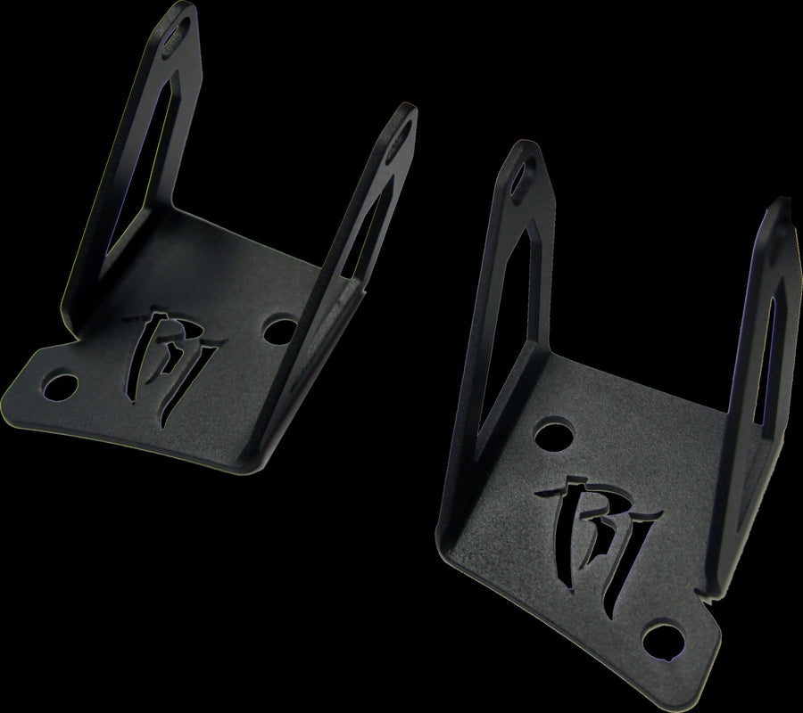 Vehicle-Specific Mounts & Brackets by Rigid: Two black A-pillar brackets with a cut-out Rigid logo are shown against black.