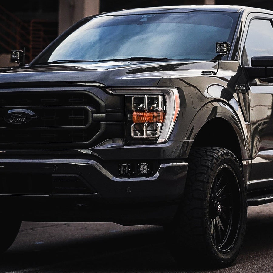 Vehicle-Specific Mounts & Brackets by Rigid: A black Ford F-150 with pods on both A-pillar brackets parked in a garage.
