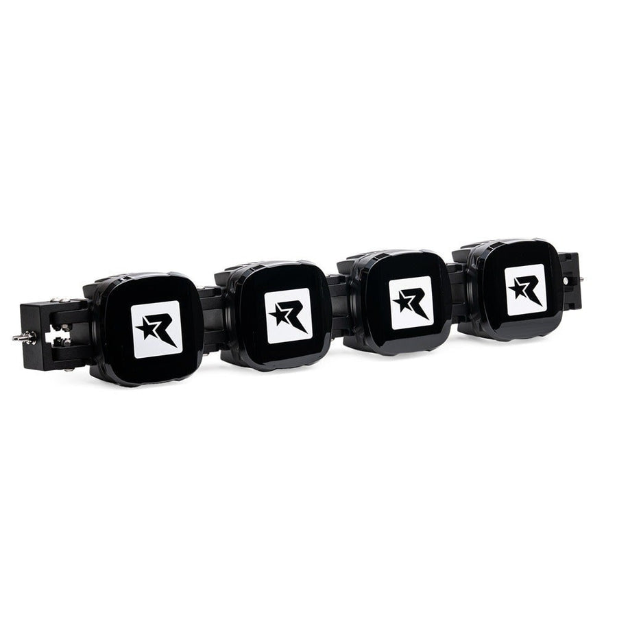 Phoenix Lights by Rigid: Four-pod connect bar with black covers bearing the Rigid R logo fitted to each pod.